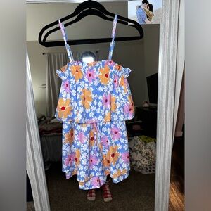 Women’s pink lily romper with adjustable straps